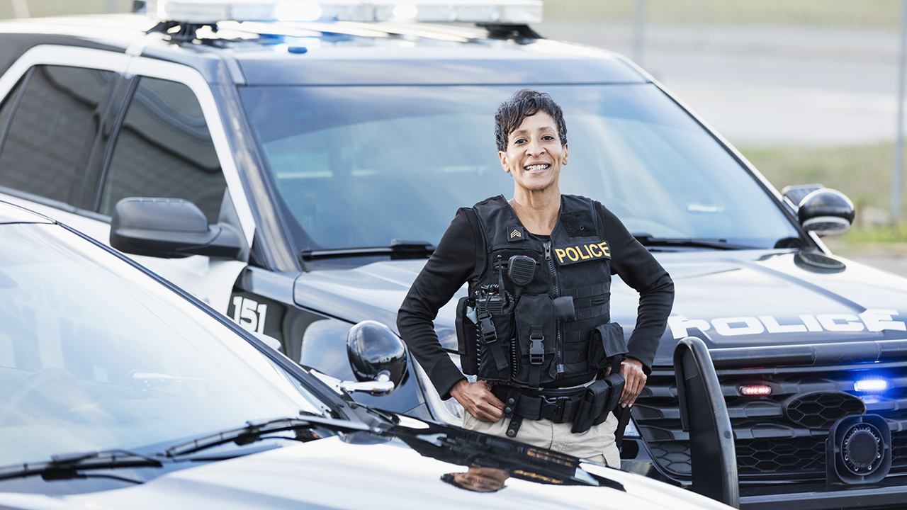 Police officer loaded with equipment