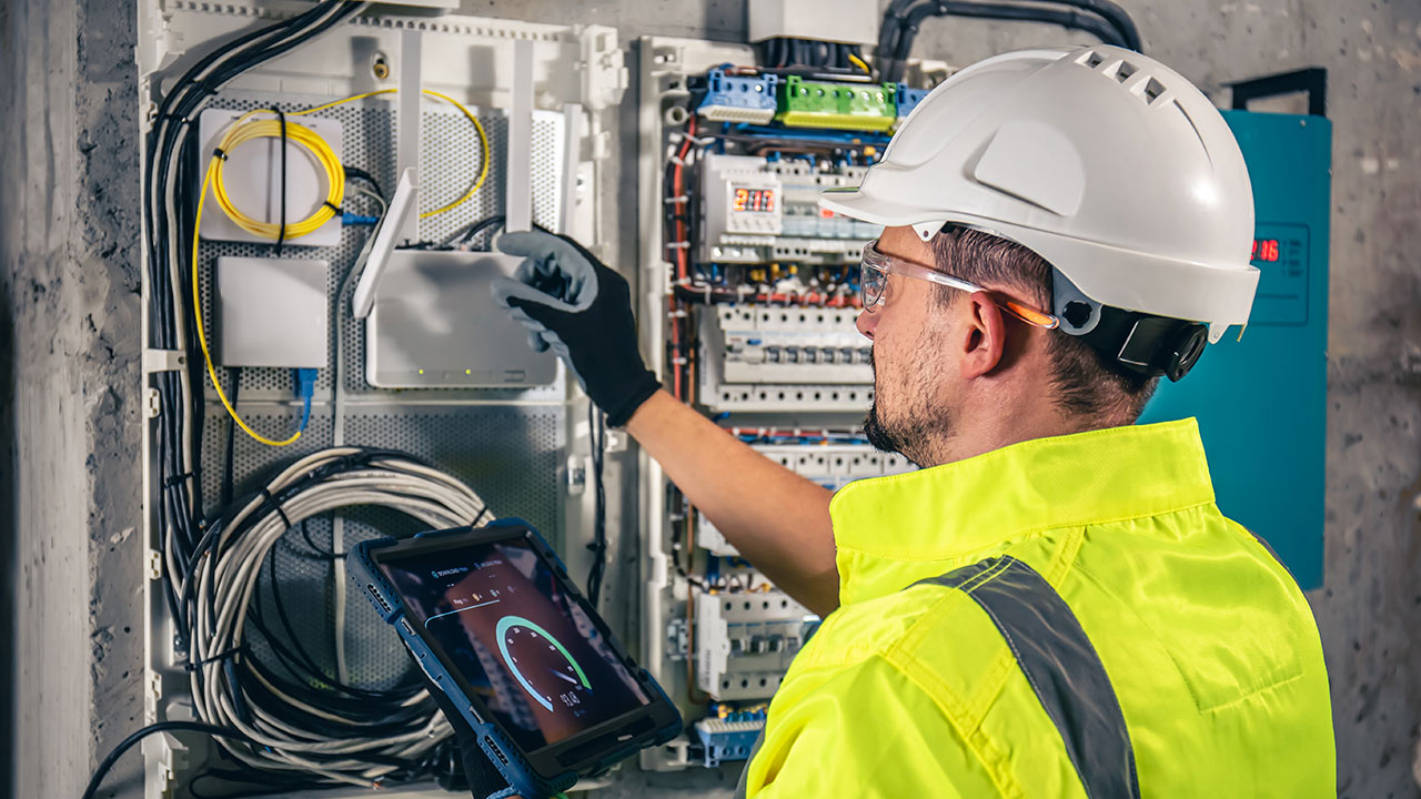 Technician fixing cables