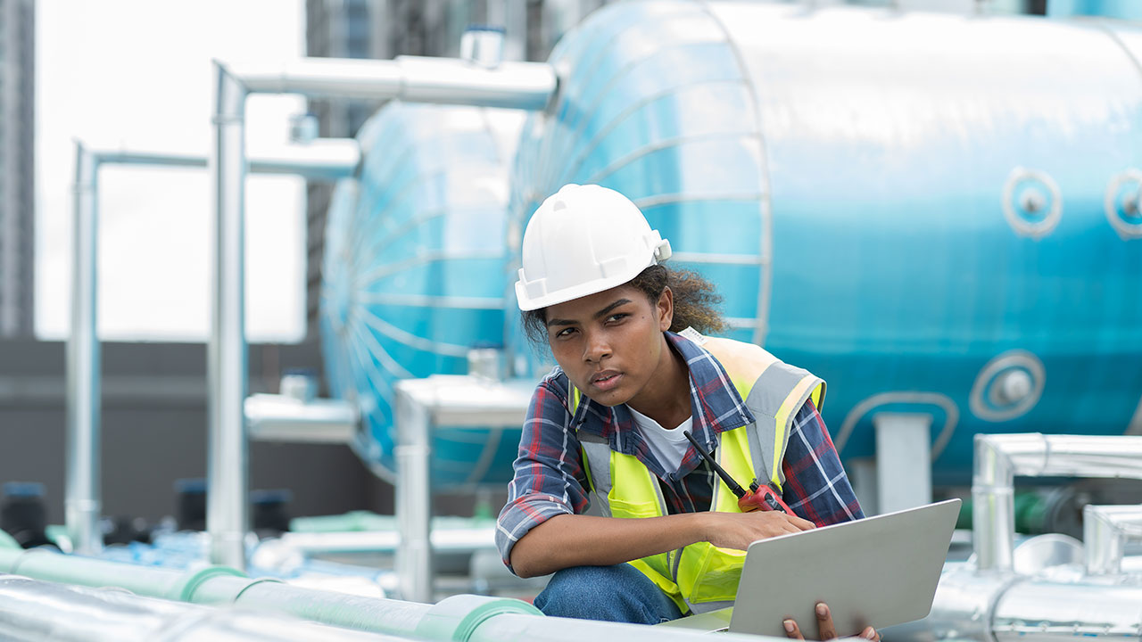 Worker analyzing processes at an industrial plant