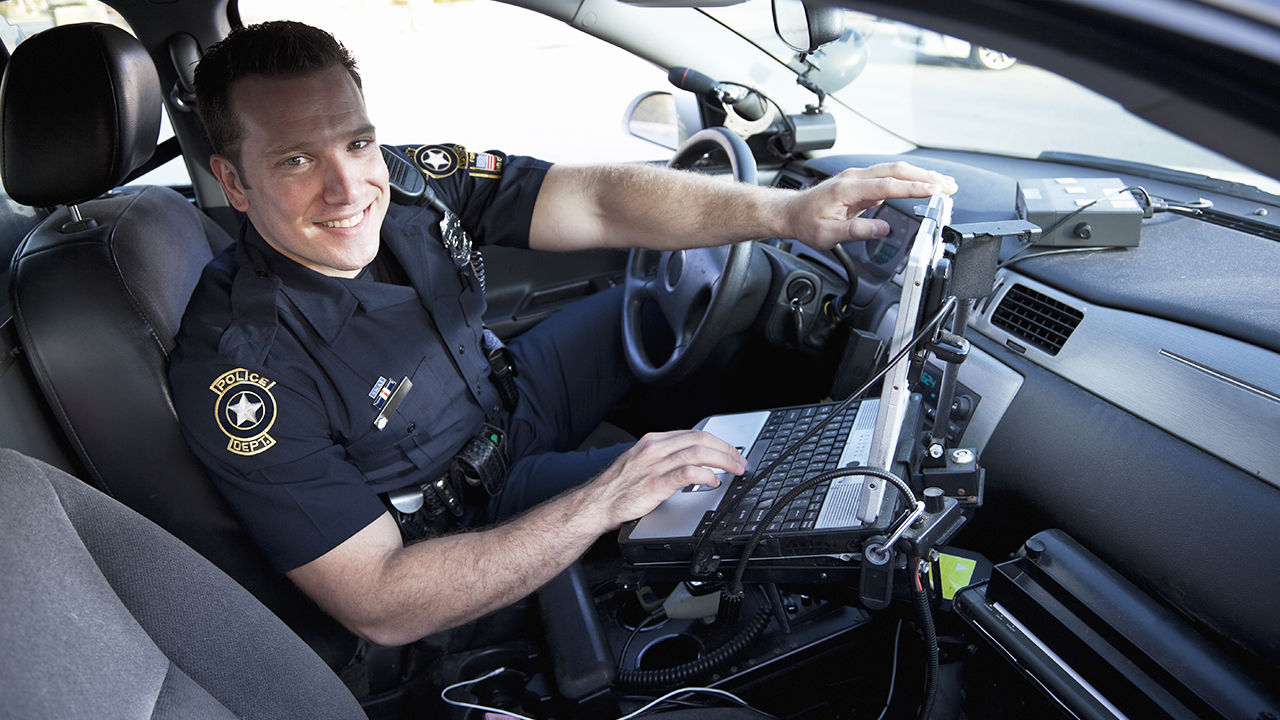 Officer using a mobile data computer