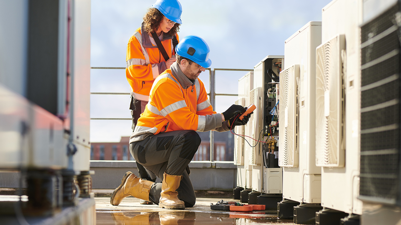 Technicians replacing equipment