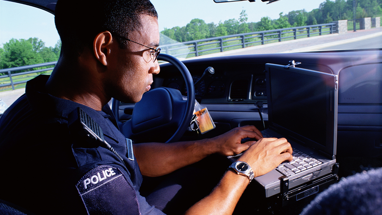 Police officer using a connected device